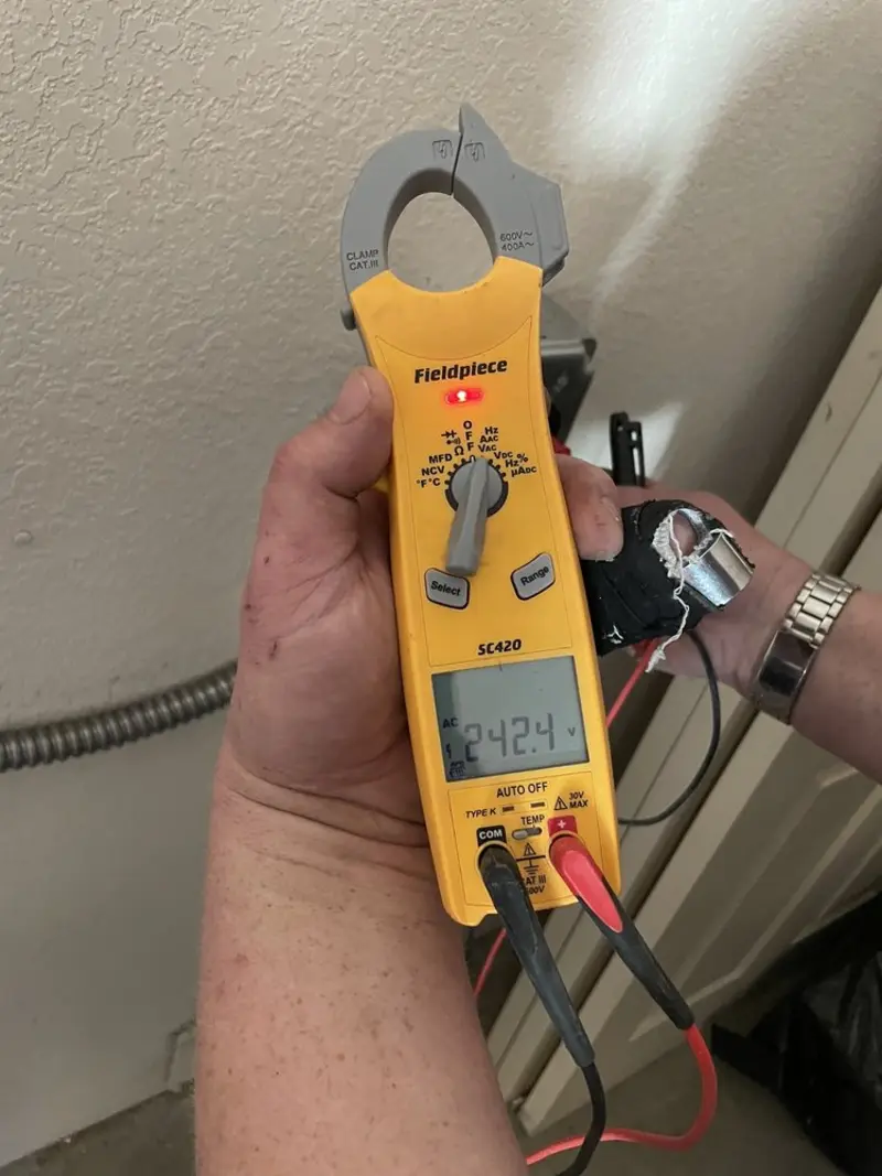 Voltage testing with clamp meter during Circuit Breaker Repair in Broomfield